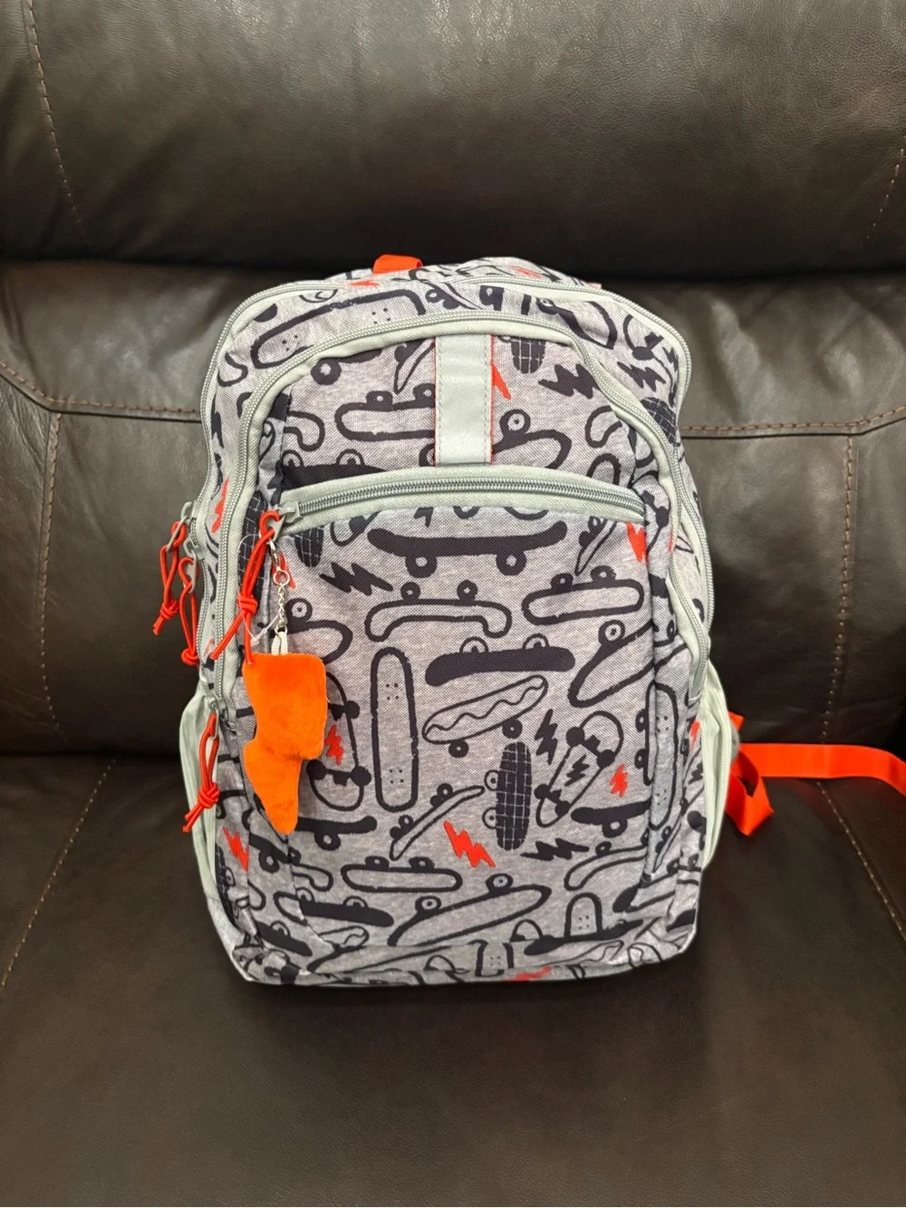 New with tags Kids Skateboard Print Backpack in Gray with Orange Accents